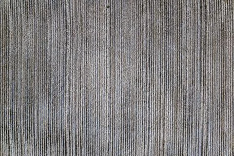Fluted surface, vertically grooved from rough concrete, rough surface Fotos de archivo