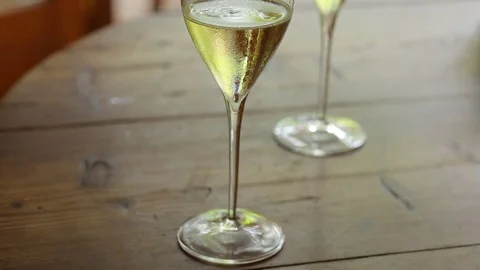 Flutes filled with sparkling prosecco, in a restaurant in Conegliano Stock Footage
