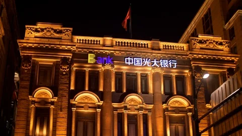 Fluttering Red Chinese Flag on Ceb Bank Building on the Bund at Nighttime Stock Footage 121194773