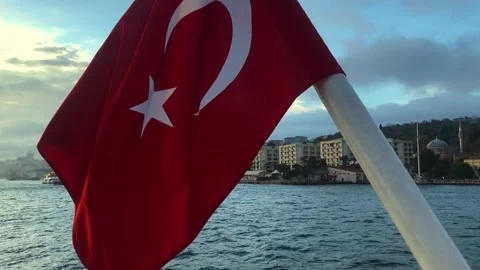 The fluttering of the Turkish flag against the backdrop of the Bosphorus Stock Footage 214497556