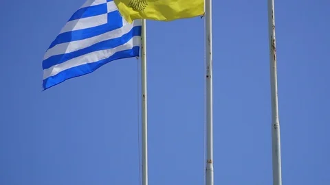 Fluttering in wind flags of Cyprus and Greece against blue sky Video stock 107551509