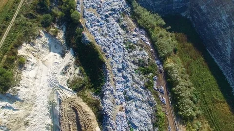 Fly about garbage dump bordering whith agricultural field Video stock 80985893