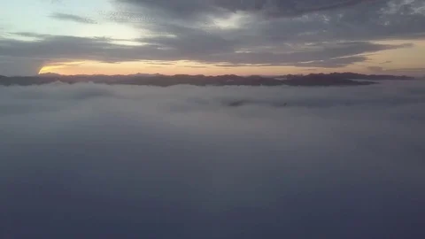 Fly above the clouds during sunrise. Stock Footage 80006771