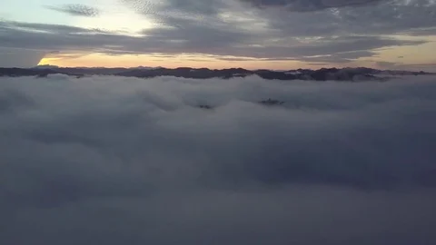 Fly above the clouds during sunrise. Stock Footage 80007183