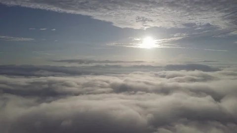 Fly above the clouds during sunrise. Stock Footage 80013735