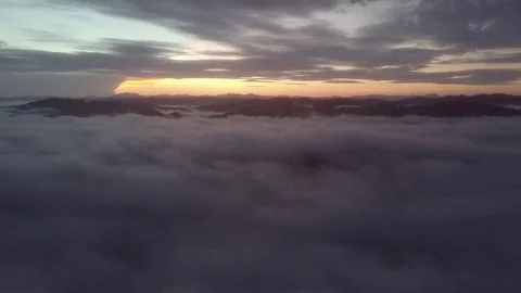 Fly above the clouds during sunrise. Stock Footage 80014719
