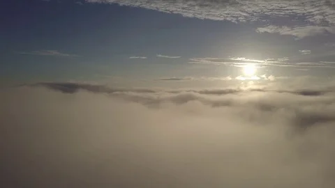 Fly above the clouds during sunrise. Stock Footage 80015538