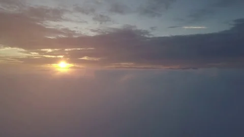 Fly above the clouds during sunrise. Stock Footage 80017024