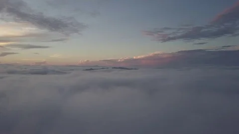Fly above the clouds during sunrise. Stock Footage 80018025