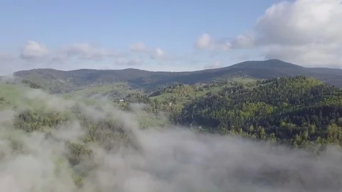 Fly above clouds over green nature Stock Footage 85258652