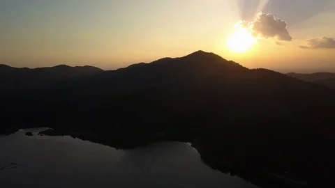 Fly above a lake at sunset time in chiang mai thailand Stock Footage 100800087