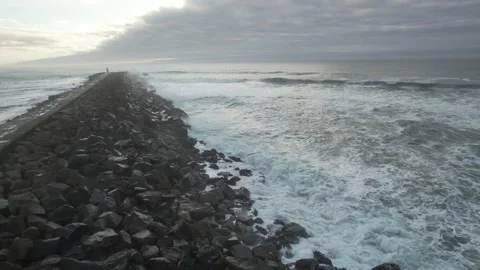 Fly Above Powerful Sea Waves Crashing on The Pier Rocks  Stock Footage 167945960