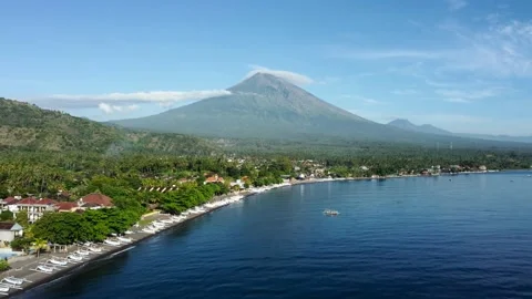 Fly along black sand beach with volcano mountains Stock Footage 161783530