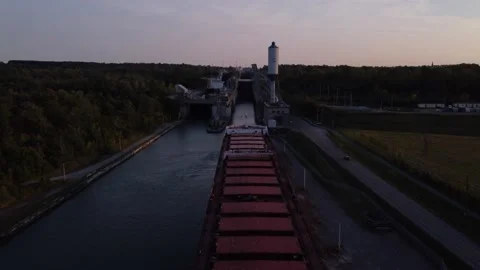 Fly along a cargo ship and canal locks Stock Footage 255404643
