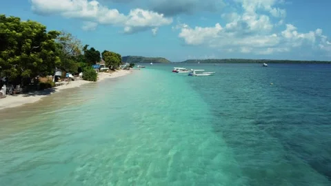 Fly along white sand beach small tropical island Stock Footage 165844589