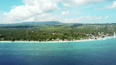 Fly along white sand beach small tropical island Stock Footage 165844985