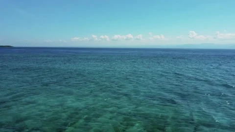 Fly along white sand beach small tropical island Stock Footage 165976775