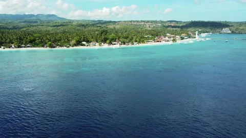 Fly along white sand beach small tropical island Stock Footage 166079668