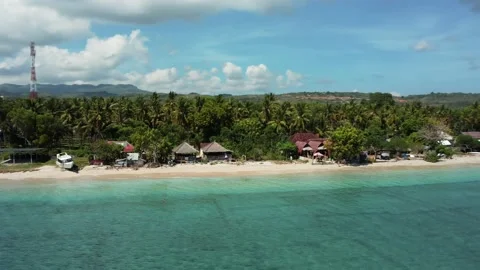 Fly along white sand beach small tropical island Stock Footage 166144701