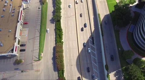 Fly And Hover Over Busy Highway And Office Buildings With Downtown View Stock Footage 65795505