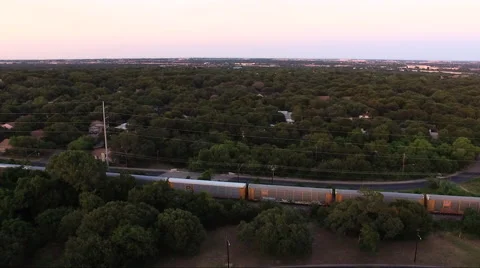 Fly And Rotate Over Train And Tracks At Sunset Stock Footage 65795520