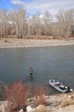 Fly angler casting on large river in Idaho Stock Photos