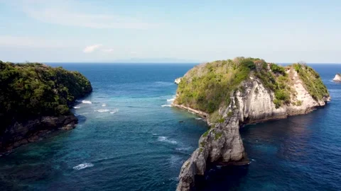 Fly around cliff and rocks over ocean along coast Stock Footage 160252869