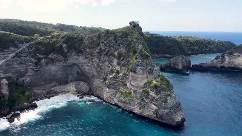 Fly around cliff and rocks over ocean along coast Stock Footage 161782918
