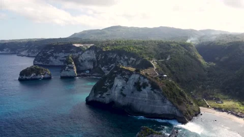 Fly around cliff and rocks over ocean along coast Stock Footage 161783829