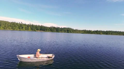 Fly around fisherman on the lake 스톡 동영상 49664553