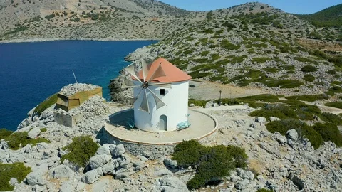Fly around the mill on island of Simi, panormitis monastery, beautiful Bay and a Stock-Footage 118830843