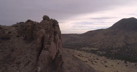 Fly around rock faces reveals main road to Alpine, Texas, USA drone aerial 4K Stock Footage 111316192
