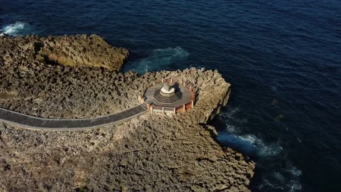 Fly around sanctuary on the cliff over ocean Stock Footage 165844103