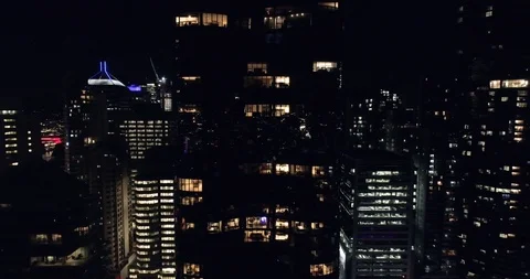 Fly around scysraper in night Stock Footage 99065336