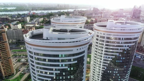 Fly around three modern buildings in the heart of a big city. Aerial view of the Stock-Footage 148508804