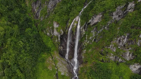 Fly around waterfall in mountains Stock Footage 111779031