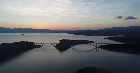 Fly away from beautiful bridge in sunset dusk Rijeka Krk Croatia Video stock 75920834