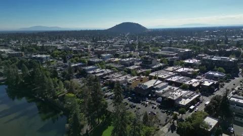 Fly Away From Downtown Bend with Pilot Butte in View on Clear Summer Day Video stock 249749911