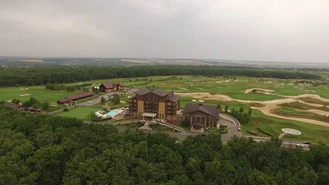 Fly away from the house with a golf course Stock Footage 83096689