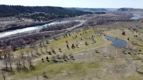 Fly away from River and Golf Course Stock Footage 310573273