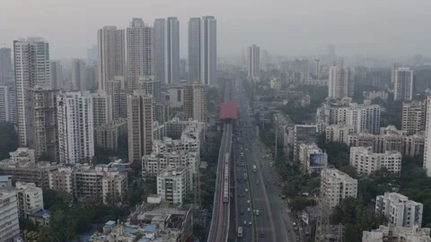 Fly Back On A Busy Highway With High-Rise Buildings In Mumbai City, India. Vídeos de archivo 235676200