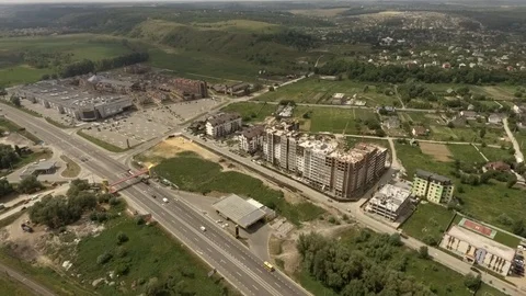 Fly back gradually overlooking the forest and mountains road Stock Footage 111874385