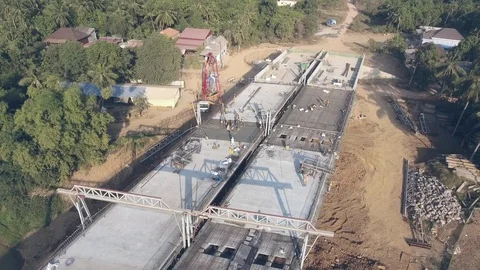 Fly back over the new bridge under construction Stock Footage 121992621