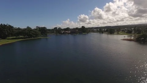 Fly Back Over Pond Hawaii Sunny Park Drone Footage Stock Footage 99475602