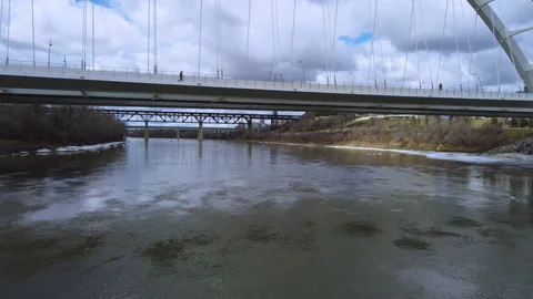 Fly Back from Walterdale Bridge over North Saskatchewan River Edmonton Stock Footage 152647115