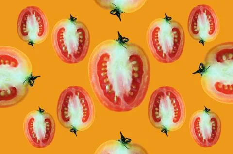 Fly of beautiful trendy seamless pattern cherry tomato isolated on orange Stock Photos
