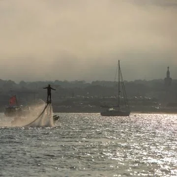 Fly board acrobatics while flying on aquaflyer water jetpack, Arcachon Stock Photos