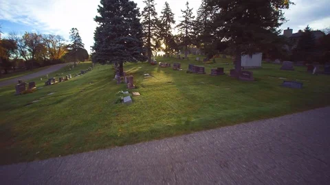 Fly by cemetary at sunset Video stock 105830138
