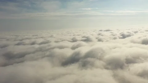 Fly on the clouds with the morning sun Clouds move gently in the sky and sun  Video stock 119423800