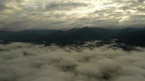 Fly on the clouds with the morning sun Clouds move gently in the sky and sun  Stock Footage 119524279